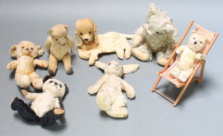 A Merrythought figure of a rabbit 17", some wear to foot, a blonde bear with articulated limbs 16", 3 other teddybears, a pajama case in the form of a dog and a dolls wooden folding deckchair 