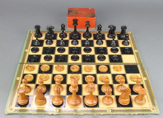 A Staunton pattern turned wooden chess set, together with a cardboard chessboard and a drafts set 