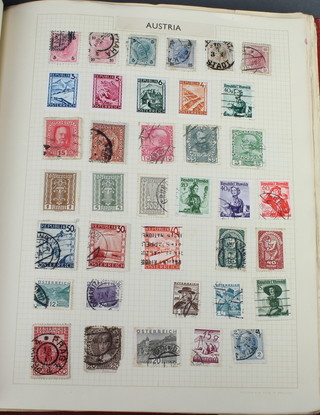 A red album of GB Colonial and World stamps including 3 penny reds