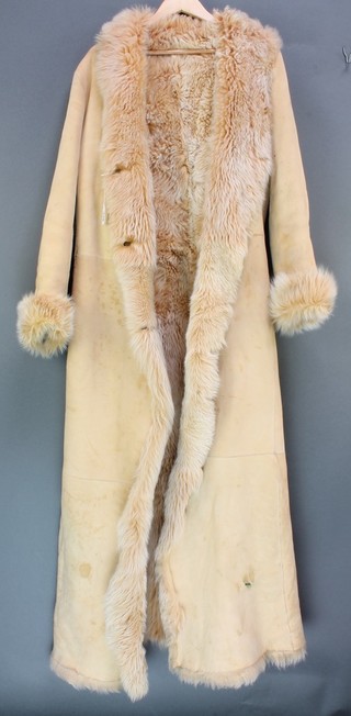 A lady's sheepskin coat size 14, retailed by Harrods and a gentleman's sheepskin jacket (there is a slight stain to the collar)
