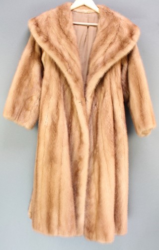 A lady's full length natural brown mink coat by Autumn Haze together with a valuation dated 1976 