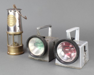 A Miner's safety lamp by The Protector Lamp and Lighting Co. Type 1A together with 2 British Railways hand signalling lanterns 