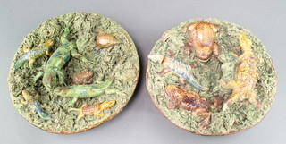 A pair of Portuguese wall plaques decorated with crocodiles, lizards and frogs with encrusted foliate decoration 9 1/2" 