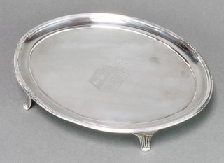 Batemans, a George III oval silver card tray with chased armorial, London 1797, makers Peter and Ann Bateman, 8 1/2" diam, 306g