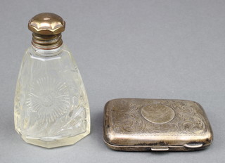 A silver chased cigarette case Birmingham 1912 together with a silver mounted toilet bottle 48 grams 
