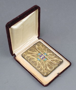 An Edwardian silver gilt filigree and enamelled card case decorated with flowers 4" x 3" in a fitted case 
