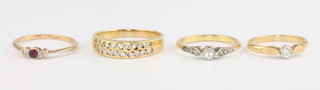 Four 18ct yellow gold diamond set rings, sizes H, J, K and O 