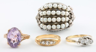 An 18ct yellow gold ring size J, a ditto size K, a 9ct gem set ring size L and a silver plated dress ring 