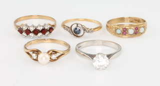 Five 9ct gold gem set rings, sizes L, L, N, P and Q