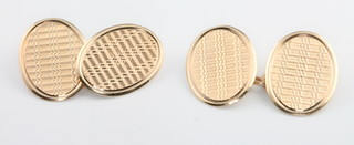 A pair of 9ct yellow gold engine turned cufflinks 3.8 grams 