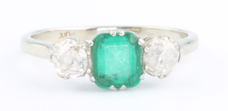 A platinum emerald and diamond 3 stone ring, size M 