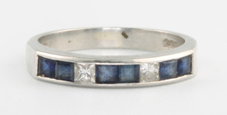 A platinum sapphire and diamond ring with 6 princess cut sapphires and 2 princess cut diamonds, size M 