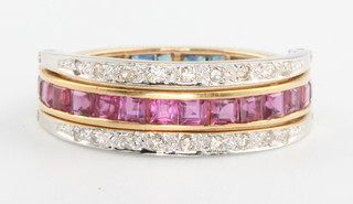 An 18ct yellow gold triple half eternity ring with diamonds, rubies and sapphires, size M 