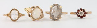 Four 9ct yellow gold gem set rings sizes M, M 1/2, N and N 