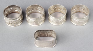 A set of 4 Indian sterling silver repousse napkin rings, a rectangular ditto 80 grams