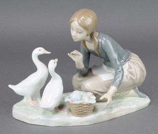 A Lladro group  girl with 2 geese and a basket of vegetables 4849 9 1/2" 