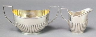 A silver demi-fluted cream jug London 1898 and a matched George V silver sugar bowl London 1910, 187 grams