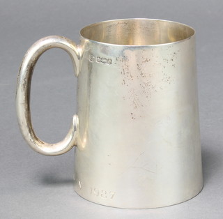 An Art Deco silver mug with chased monogram, Sheffield 1926