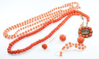 A coral bead necklace 14", ditto ear studs, brooch and a necklace 