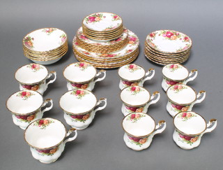 A Royal Albert Country Old Country Roses tea and coffee set comprising 6 coffee cups, 6 saucers, 5 tea cups, 7 saucers, 6 small plates, 6 side plates and 6 dessert bowls 