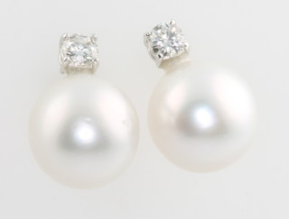 A pair of 18ct white gold pearl and diamond ear studs approx. 0.43ct diamonds