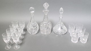 A set of 8 cut glass wine glasses 5 1/2", 6 tumblers 3 1/2" and 3 decanters 