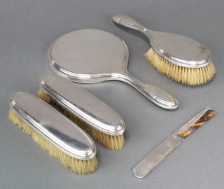A 5 piece silver brush set, mixed dates