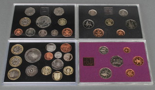 Four uncirculated coin sets - 1980, 1985, 1998 and 2010 