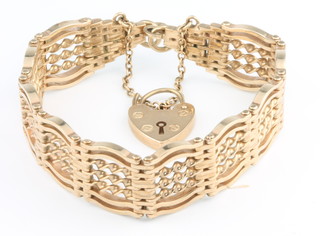 A 9ct yellow gold gatelink bracelet and padlock, 35 grams 