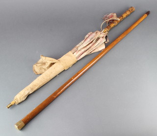 A 19th Century walking cane with 18ct gold knop together with a parasol with bamboo handle 