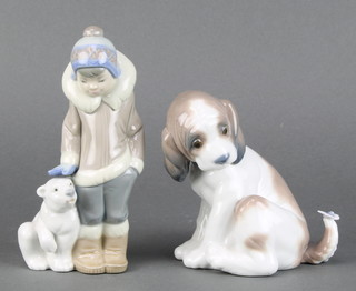 A Lladro figure of a dog with butterfly on his tail 4", a do. boy with baby polar bear 5" 