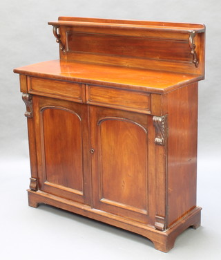 A Victorian mahogany chiffonier with raised back fitted 2 long drawers above arched panelled doors, raised on a platform base 46"h x 42"w x 16"d 