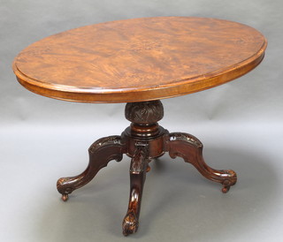 A Victorian oval inlaid figured walnut Loo table raised on turned column and tripod base 28"h x 52"l x 37"w 
