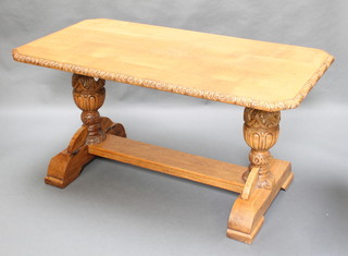 A Victorian carved light oak refectory table, raised on cup and cover supports with H framed stretcher 31"h x 59"w x 32"d 