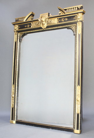 A 19th Century Empire style arched plate mirror contained in a black and gilt painted frame surmounted with a broken pediment and figure of a cherub 59 1/2"h x 44"w 