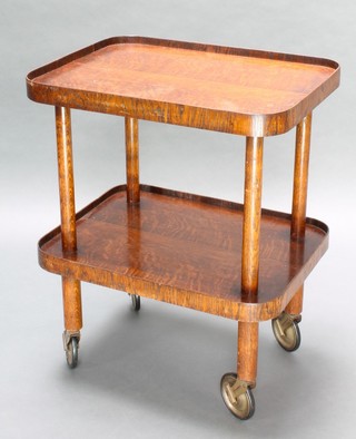 An Art Deco rectangular oak 2 tier trolley raised on turned supports 30"h x 24"w x 18"d 