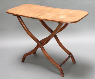 A 19th Century rectangular mahogany folding coaching table raised on X framed supports 20"h x 36"w x 17"d 