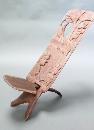A West African carved wooden slat back birthing chair 39"h x 11"w 