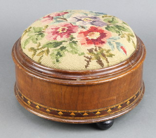 A Victorian circular mahogany footstool, the base fitted a spittoon, raised on bun feet 5"h x 11" diam. 