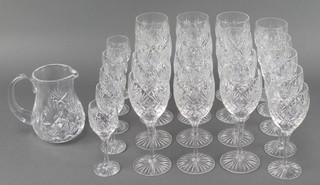 A service of Royal Doulton glassware comprising 12 large wine glasses, 5 wine glasses, 5 sherry glasses, a water jug and a decanter (f) and stopper 