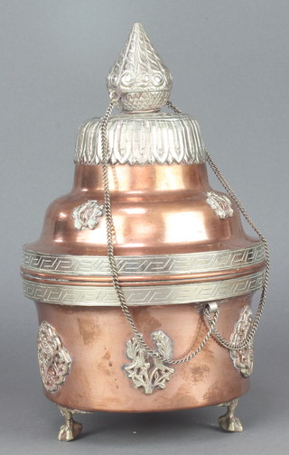 An Indian cylindrical copper and white metal tiffin box and cover raised on 3 paw feet 12" 