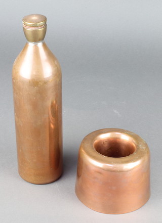A 19th Century circular copper jelly/ice cream mould 3 1/2" x 5" diam. (some dents) and a copper and brass hot water bottle 11" 