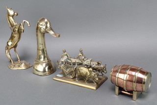 A copper and brass model of a barrel raised on stillage 2" x 4", a gilt metal model of a bullock, cart and attendants, 5" x 7" x 4", a brass figure of a rearing horse 10" and a door stop in the form of a ducks head 9" 