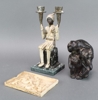 A bronzed twin light candelabrum in the form of a seated liveried servant, a resin bronzed figure group of 3 monkeys 5", after the antique a resin tile with seated figures 5" x 6" (f and r)