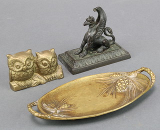 A Dahl, an oval bronze twin handled dish raised on 3 bun feet 6" x 3" together with a bronze figure on a rectangular base 3" x 3 1/2" and a gilt metal figure of 2 seated owls 2" x 2" 
