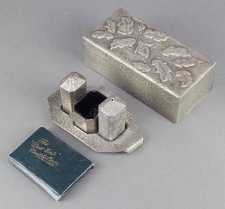 An Art Nouveau rectangular planished pewter cigarette/trinket box with hinged lid 2" x 7" x 3 1/2", an Art Deco Old English 3 piece planished pewter condiment set and a set of West End needles case
