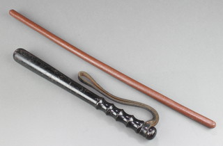 A turned wooden police truncheon 15" and a swagger stick 24" 
