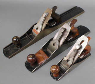 A Stanley Bailey no.7 jack plane, a steel jack plane the blade marked Record 9", a Stanley no.4 smoothing plane (body has been welded and is f and r)