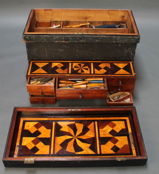 A 19th Century pine carpenters trunk, the interior inlaid with parquetry and containing spoke shaves, mortice gauges, 2 saws, various chisels etc, together with 1 volume of James Newlands "The Carpenters and Joiners Assistant" 