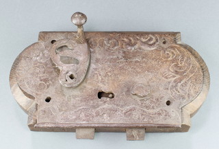 A 17th/18th Century Continental iron lock contained in a wooden mount 13" x 7" 
